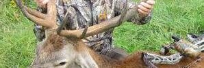 Man Posing With Shot Deer