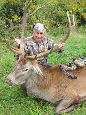Man Posing With Shot Deer