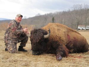 Hunter with buffalo kill
