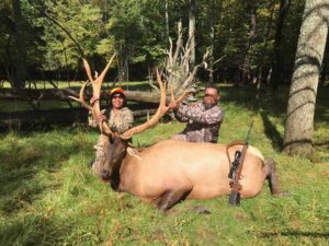 Hunters with Elk kill
