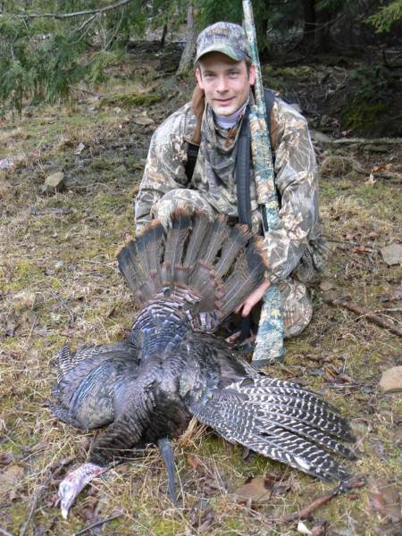 Hunter posing with turkey
