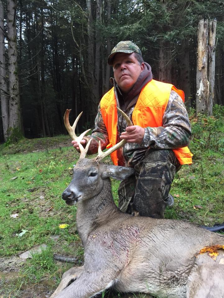 Hunter with Whitetail Deer