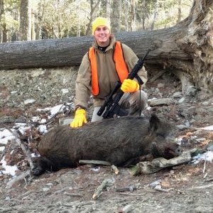 Boar Hunter posing with trophy