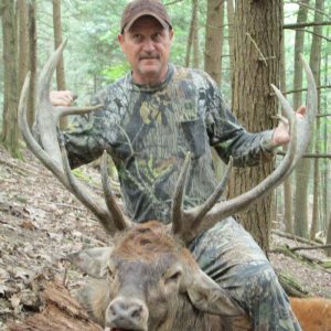 Hunter With Red Stag Deer