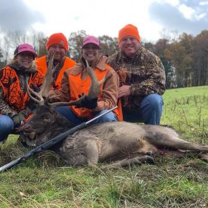 Four Hunters posing with Hunted Fallow Deer