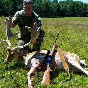 Hunter with Fallow Deer