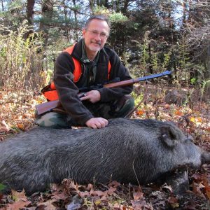 Hunter Posing With Boar