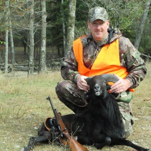 Male Hunter with Black Hawaiian Ram