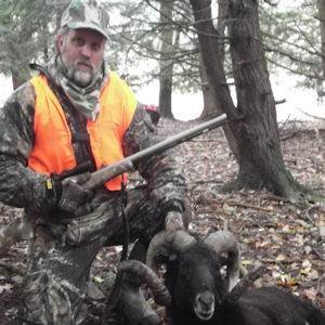 Male Hunter with Black Hawaiian Ram