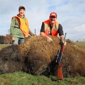 Two Hunters with Buffalo