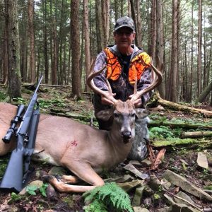 Hunter with Whitetail Deer