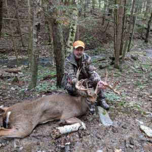 Hunter with Whitetail Deer