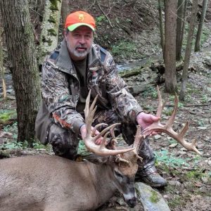 Hunter with Whitetail Deer