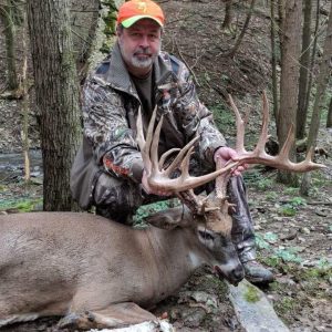 Hunter with Whitetail Deer