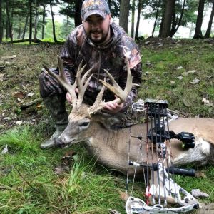 Hunter with Whitetail Deer