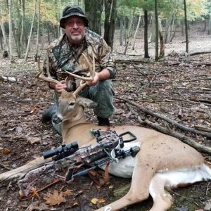Hunter with Whitetail Deer