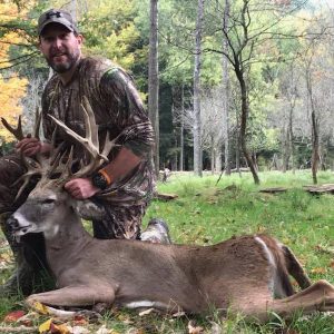 Hunter with Whitetail Deer