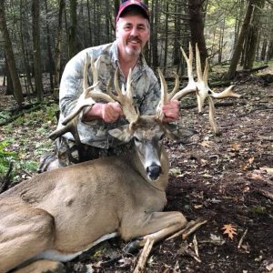 Hunter with Whitetail Deer