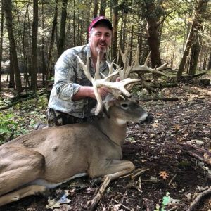 Hunter with Whitetail Deer