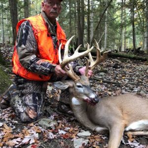 Hunter with Whitetail Deer