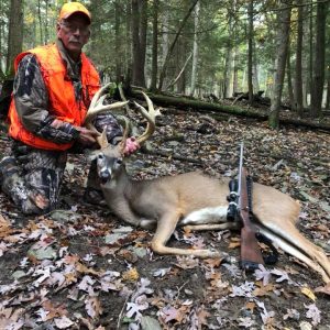 Hunter with Whitetail Deer