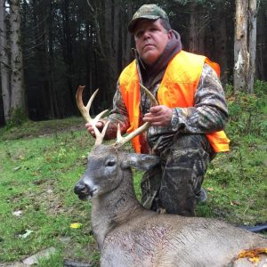 Hunter with Whitetail Deer