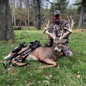 Hunter with Whitetail Deer