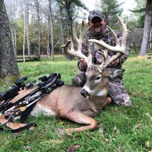 Hunter with Whitetail Deer