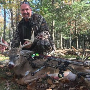 Hunter with Whitetail Deer