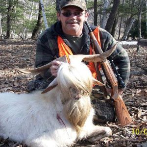 Man with hunted spanish goat