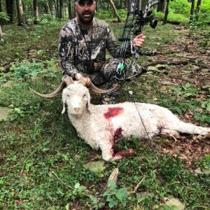 Man with Spanish Goat he Hunted