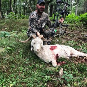 Man with Spanish Goat he Hunted