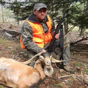 Man with hunted spanish goat