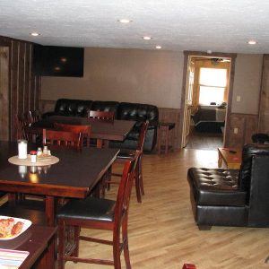 Tables and Couches inside Tioga Ranch Hunting Lodge