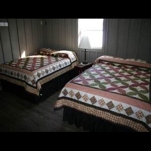 2 Queen beds inside Tioga Ranch Hunting Lodge